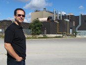 Michael Melo in front of printing plant